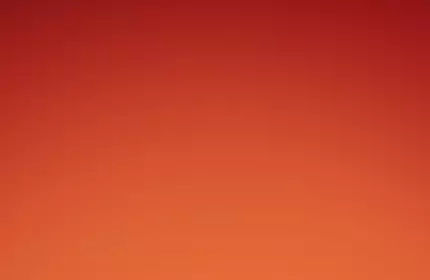 Two tubes of Lancome Juicy Tubes lip gloss are displayed against a vibrant red and orange gradient background.