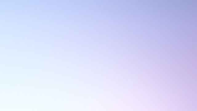 A bottle of Lancome perfume on a soft blue background, illuminated to highlight its sleek design.