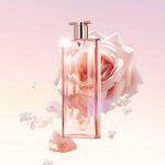 A elegant pink perfume bottle surrounded by soft rose petals and a pale rose, set against a dreamy pastel background.