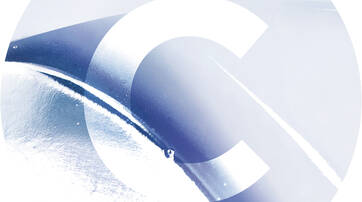 Abstract image featuring a smooth, curved surface with a gradient of blue tones, overlaid with a large white letter "C" in the center.